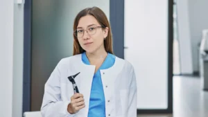 audiologist holding an otoscope